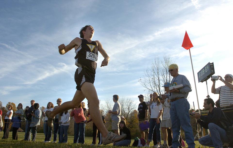 Runners compete in the cross country state championship meet at Killen's Pond State Park Saturday November 11, 2006. Tatnall's Brian Sklodowski crosses the finish line to win the boys Division II race.