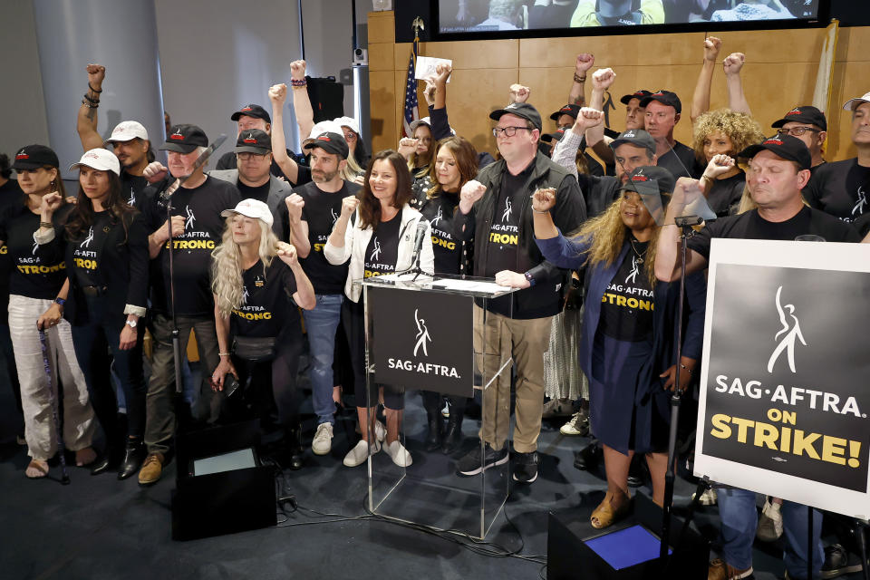 LOS ANGELES, CALIFORNIA - JULY 13: (Center L-R) Frances Fisher, Ben Whitehair, Frances Fisher, SAG President Fran Drescher, Joely Fisher, National Executive Director and Chief Negotiator of SAG-AFTRA Duncan Crabtree-Ireland, Michael Gaston, Michelle Hurd, and SAG-AFTRA members are seen as SAG-AFTRA National Board holds a press conference for vote on recommendation to call a strike regarding the TV/Theatrical contract at SAG-AFTRA on July 13, 2023 in Los Angeles, California. (Photo by Frazer Harrison/Getty Images)