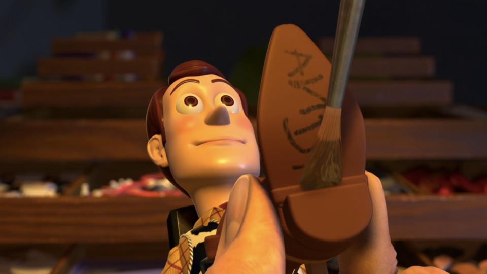 Andy's name is painted over Woody's boot