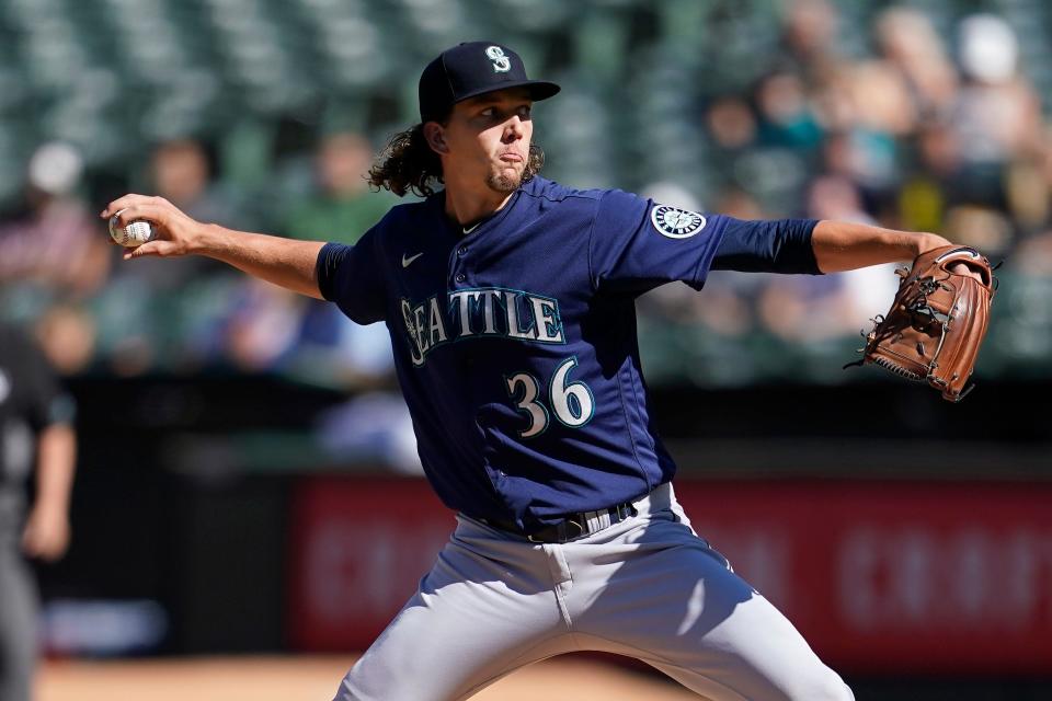 Seattle Mariners' Logan Gilbert pitches against the Oakland Athletics during the first inning of a baseball game in Oakland, Calif., Saturday, Aug.  20, 2022. (AP Photo/Jeff Chiu)