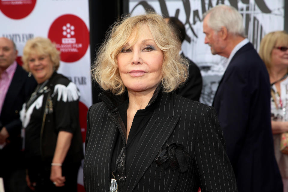 FILE - In this Thursday, April 10, 2014 file photo, Kim Novak arrives at the 2014 TCM Classic Film Festival's Opening Night Gala at TCL Chinese Theatre in Los Angeles. Novak says that cruel jabs about how she looked during the Oscar March 2 ceremony amounted to bullying that left her at first crushed and then determined to speak out in protest. Turner Classic Movies host Robert Osborne agreed to discuss it during an interview with Novak that preceded a festival screening last Saturday, April 12, 2014, of her film "Bell, Book and Candle." (Photo by Annie I. Bang /Invision/AP, file)