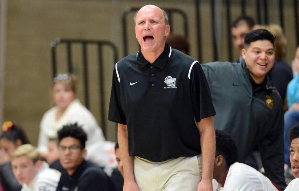 Clovis West High boys basketball coach Vance Walberg makes a point, loudly, during Wednesday night’s home opener of his second tenure with the Golden Eagles.