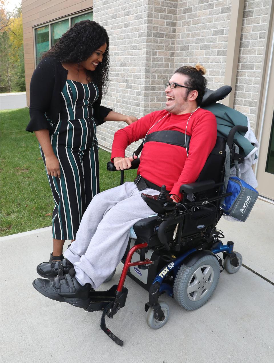 Rihanna DeLaunay, a direct care worker at Jawonio and client Alirio Magana, share a laugh at their headquarters in New City, Nov. 2, 2021.