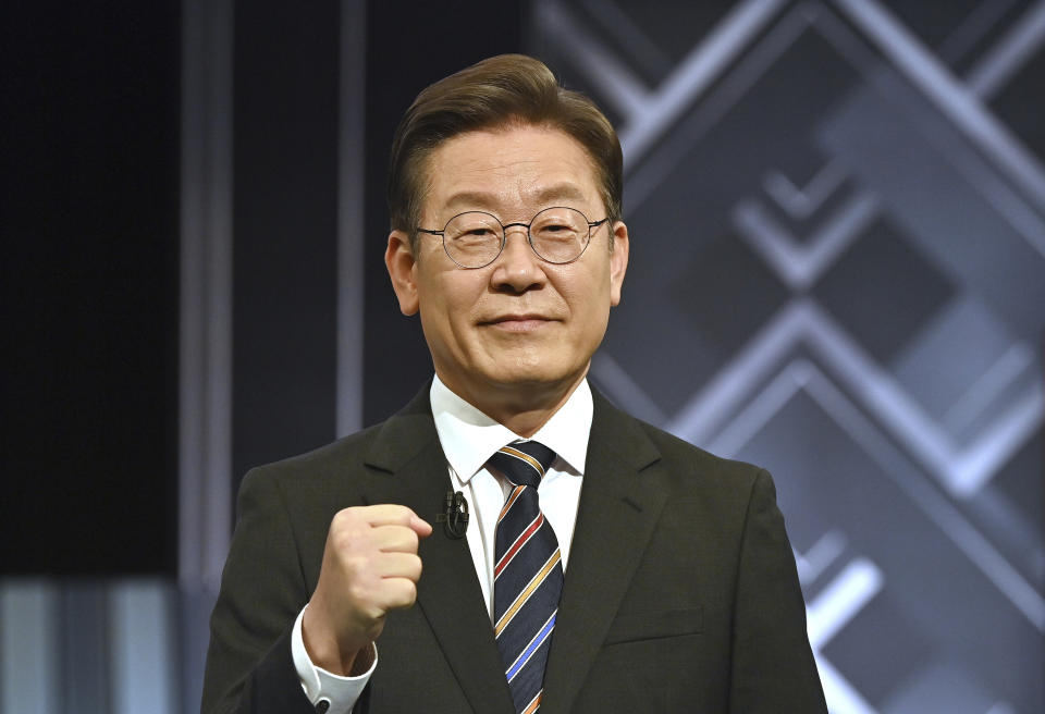 South Korea's presidential candidate Lee Jae-myung of the ruling Democratic Party poses for a photo before a televised debate for the upcoming March 9 presidential election at KBS studio in Seoul on Wednesday, March 2, 2022. (Jung Yeon-je/Pool Photo via AP)