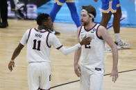 Gonzaga guard Joel Ayayi (11) and Drew Timme (2) react to a play against UCLA during overtime in a men's Final Four NCAA college basketball tournament semifinal game, Saturday, April 3, 2021, at Lucas Oil Stadium in Indianapolis. (AP Photo/Darron Cummings)