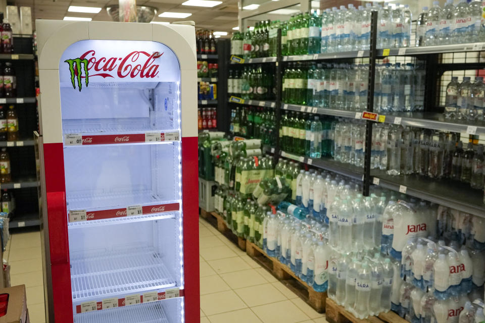 An empty CocaCola refrigerator is seen at a grocery shop in Zagreb, Croatia, Wednesday, Nov. 8, 2023. Authorities in Croatia on Wednesday recommended people drink only tap water as they investigated reports of several cases of people getting sick and suffering injuries allegedly after consuming bottled beverages. They did not say which products were being withdrawn, but photos on social media from shops suggested they were Coca-Cola brands. (AP Photo/Darko Bandic)