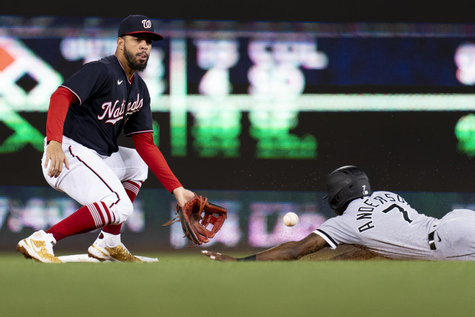 Chicago White Sox's Tim Anderson slides into second on an attempted steal, but is tagged out by Washington Nationals second baseman Luis Garcia during the third inning of a baseball game Tuesday, Sept. 19, 2023, in Washington. (AP Photo/Stephanie Scarbrough)