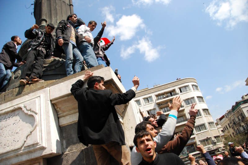 Syrian anti-government protesters shout slogans during a demonstration at Souk Al-Hamadiyeh street on March 25, 2011. On March 15, 2011, protesters marched on the Syrian capital of Damascus calling for democratic reforms, kicking off a civil war. File Photo by Ali Bitar/UPI