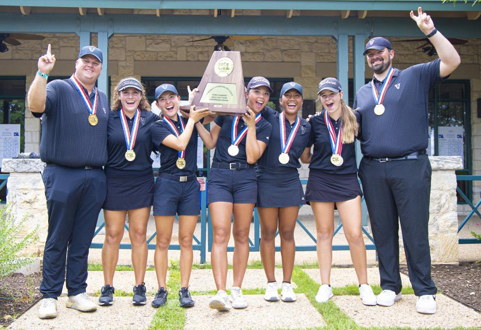 Vandegrift's head coach Aaron Ford celebrates the Texas UIL championship with team from left to right: Eden McSpadden, Mimi Burton, Breanna Hoese, Danica Lundgren, Sydney Givens and coach Jaime Sierra.