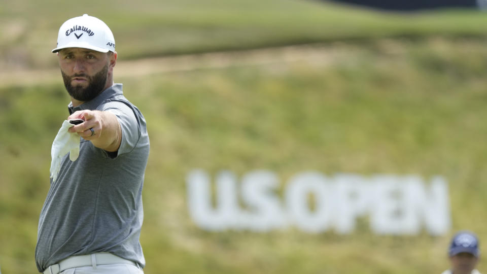 Jon Rahm points as he prepares to putt on the fourth green during a practice round of the U.S. Open golf tournament at Los Angeles Country Club, Monday, June 12, 2023, in Los Angeles. (AP Photo/Marcio Jose Sanchez)