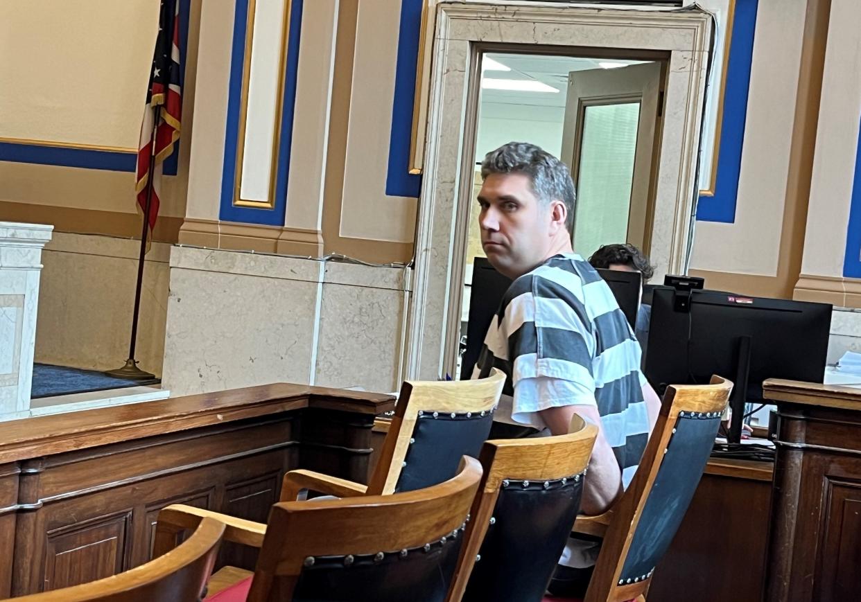 Johnathan Sexton sits in the jury box awaiting sentencing in Hamilton County Common Pleas Court on Wednesday. Sexton, who was convicted of attacking his neighbor with a machete, was sentenced to three years in prison.