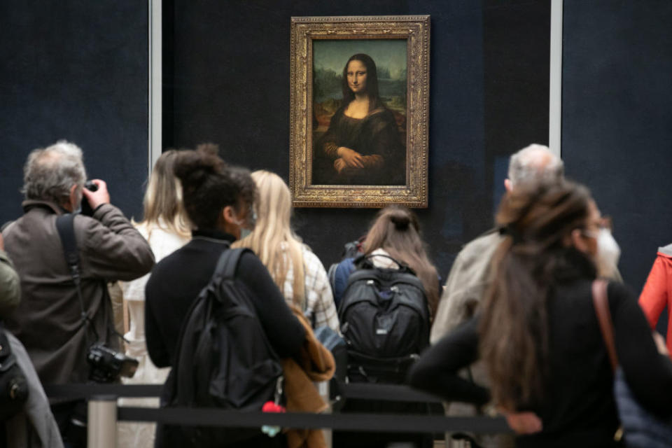 People gathering around the "Mona Lisa"