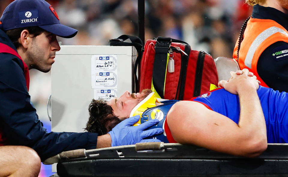 Angus Brayshaw, pictured here being taken from the field on a medicab.