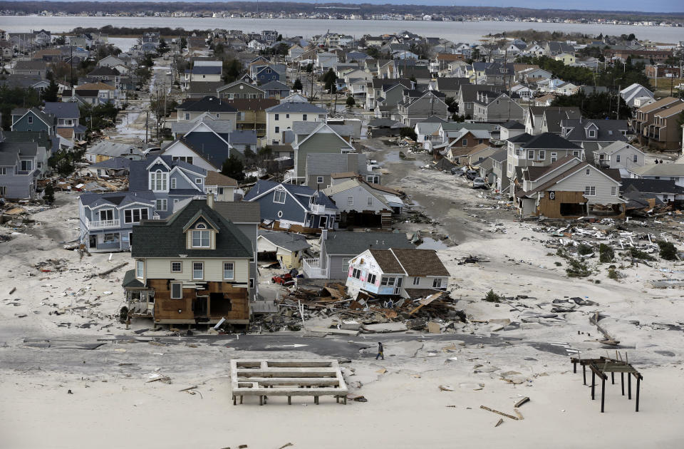 This aerial photo shows destruction in the wake of superstorm Sandy on Wednesday, Oct. 31, 2012, in Seaside Heights, N.J. (AP Photo/Mike Groll)