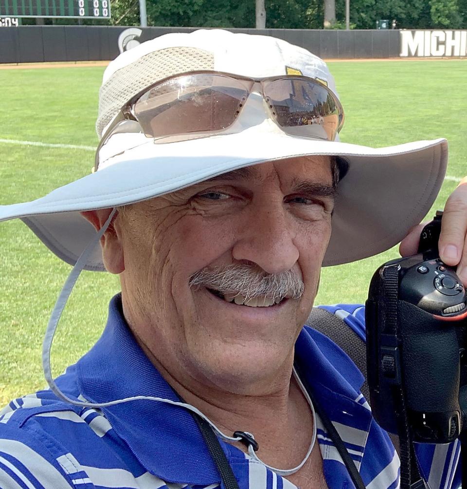 Tom Hawley has been photographing high school sports for 46 years, above at Michigan State University for the softball state finals. 
Tom Hawley/The Monroe News