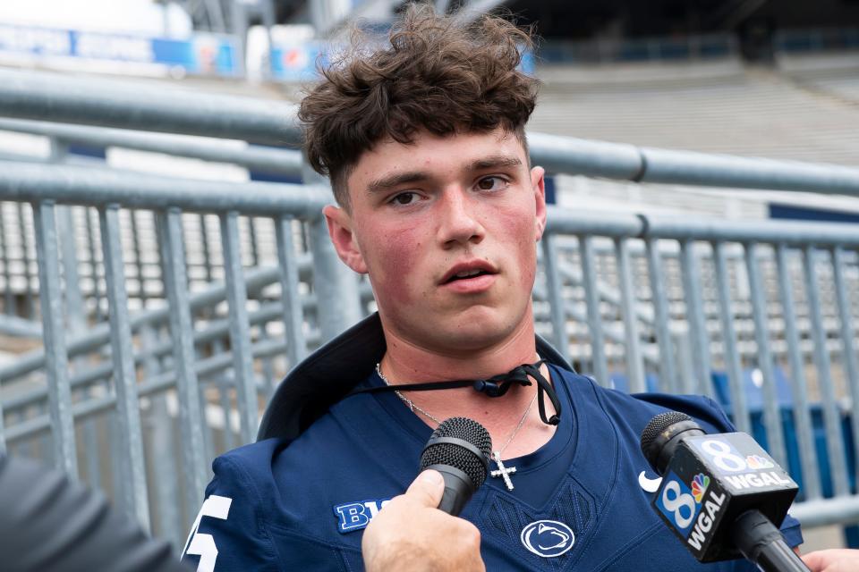 Penn State sophomore quarterback Drew Allar talks with reporters during football media day at Beaver Stadium on Sunday, August 6, 2023, in State College.