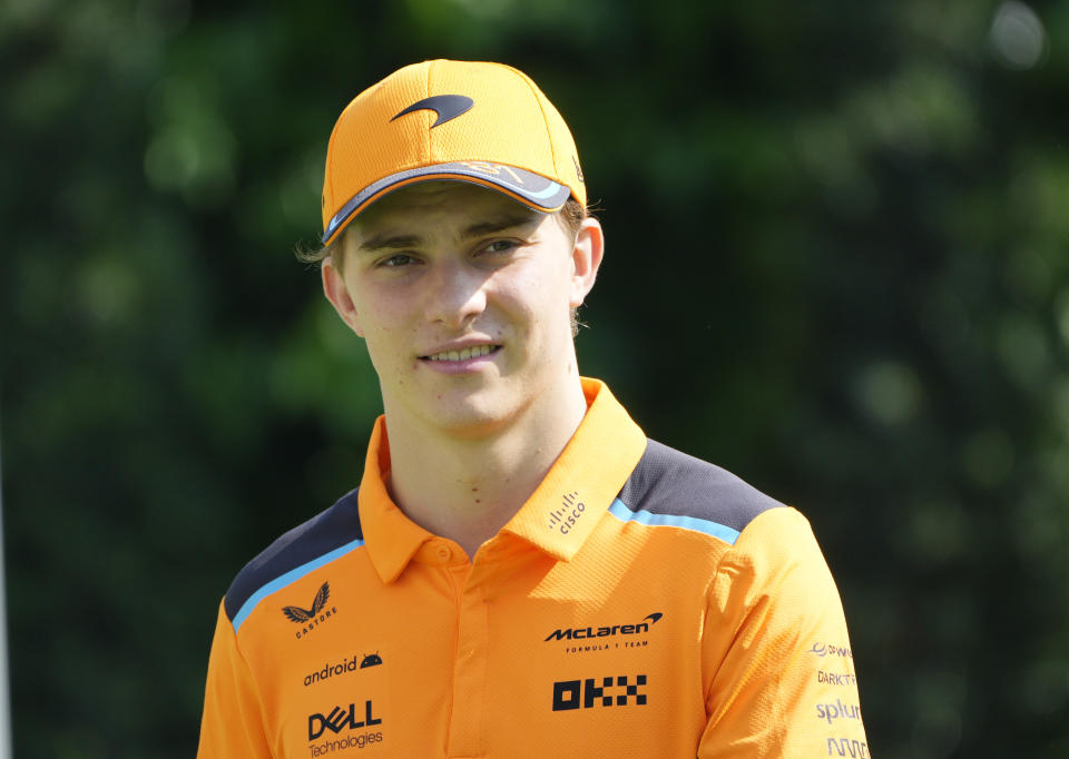 McLaren driver Oscar Piastri of Australia arrives before the first practices during the Singapore Formula One Grand Prix at the Marina Bay circuit in Singapore, Friday, Sept. 15, 2023. (AP Photo/Vincent Thian)