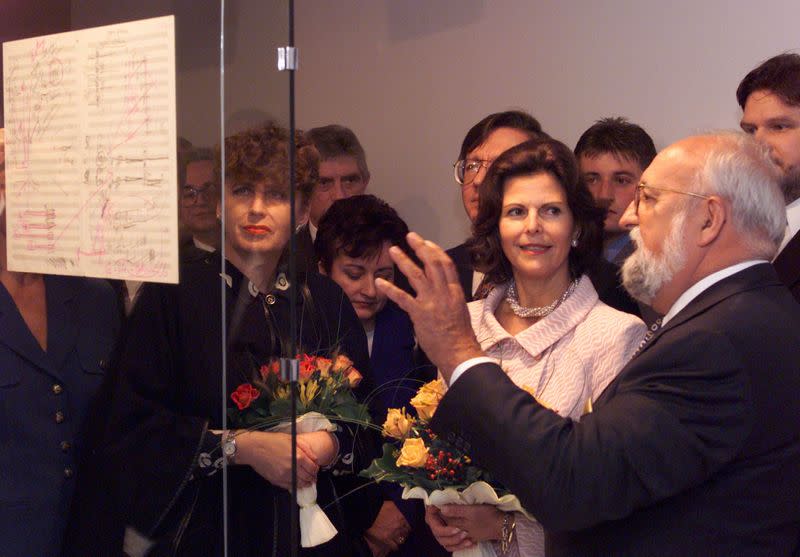 FILE PHOTO: Famous Polish composer Krzysztof Penderecki explains to Queen of Sweden Silvia his draft of a score during their visit to the Penderecki exhibition in Krakow