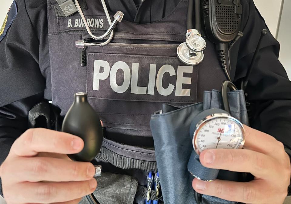 Const. Brennan Burrows of the Cape Breton Regional Police holds other equipment used for detecting impaired drivers.