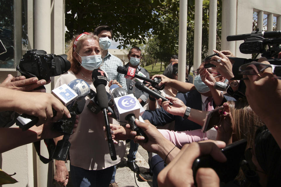 Rosibel Emerita Arriaza, the mother of Victoria Esperanza Salazar who died in police custody, talks to the press in Antiguo Cuzcatlan, El Salvador, Monday, March 29, 2021. Mexican authorities said Monday that an autopsy of Arriaza's daughter confirmed that police broke her neck in the Caribbean resort of Tulum, Mexico. (AP Photo/Salvador Melendez)