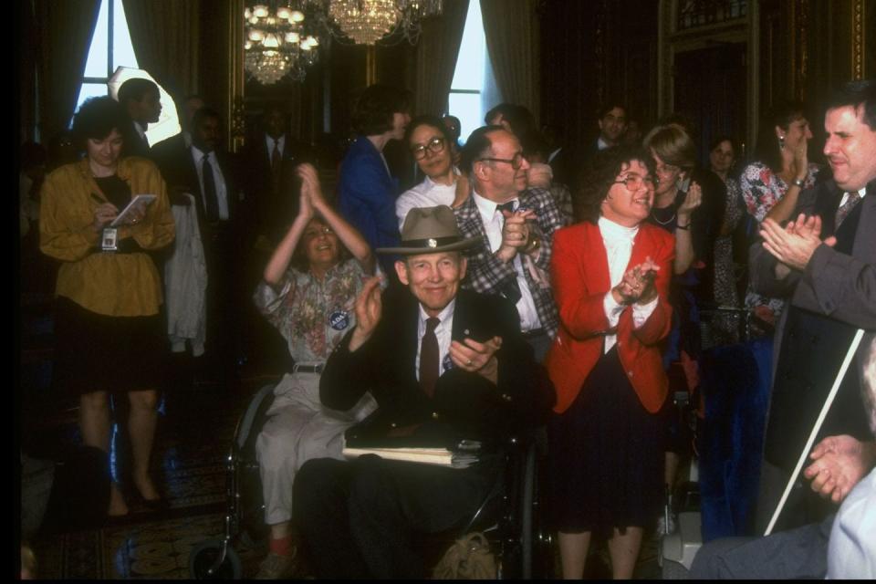 <p>People celebrate on Capitol Hill after the senate passes the Americans with Disabilities Act. </p>