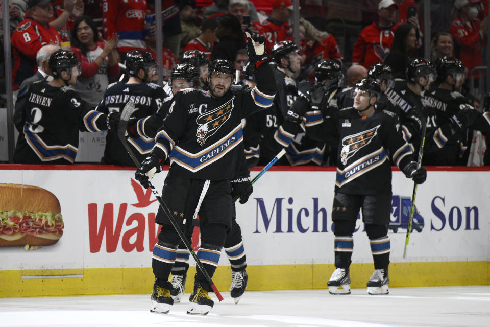 Washington Capitals left wing Alex Ovechkin (8) continues to celebrate after his goal during the second period of an NHL hockey game against the Arizona Coyotes, Saturday, Nov. 5, 2022, in Washington. (AP Photo/Nick Wass)