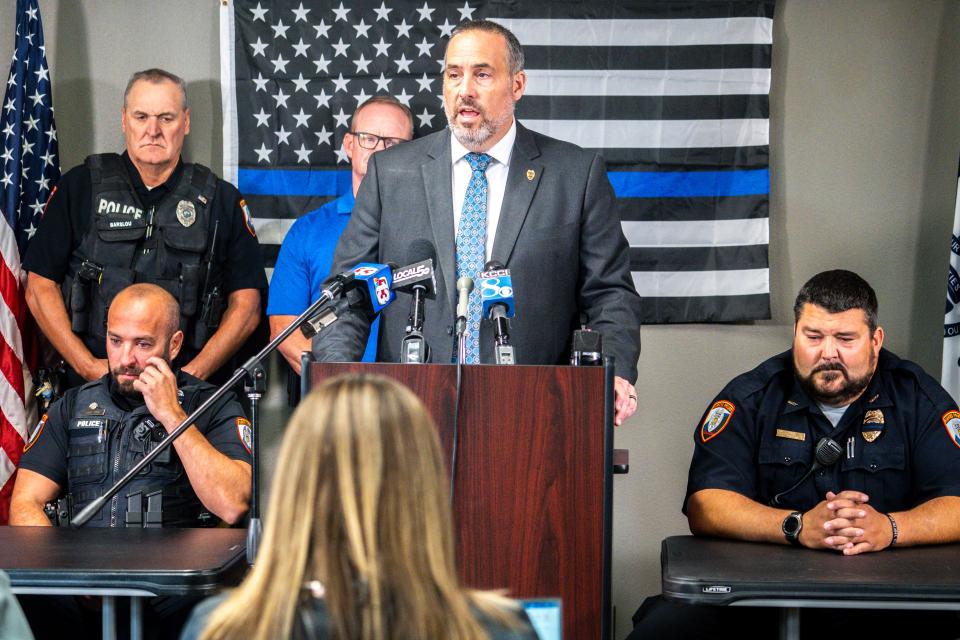 Iowa Department of Public Safety Commissioner Stephan Bayens speaks during a news conference.