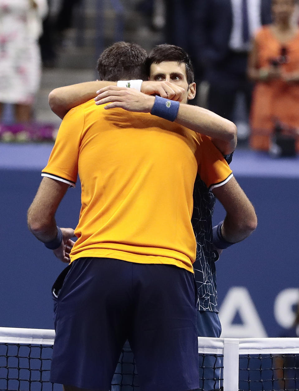 Novak Djokovic, of Serbia, right, hugs Juan Martin del Potro, of Argentina, after Djokovic defeated del Potro in the men's final of the U.S. Open tennis tournament, Sunday, Sept. 9, 2018, in New York. (AP Photo/Julie Jacobson)