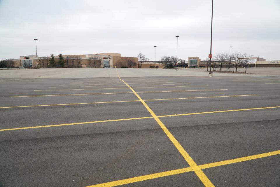 An empty parking lot at Taubman Centers' Twelve Oaks Mall in Novi, Michigan, attests to the effect of the coronavirus on the retail economy. Taubman Centers has closed most of its malls, including Twelve Oaks, until at least March 29.