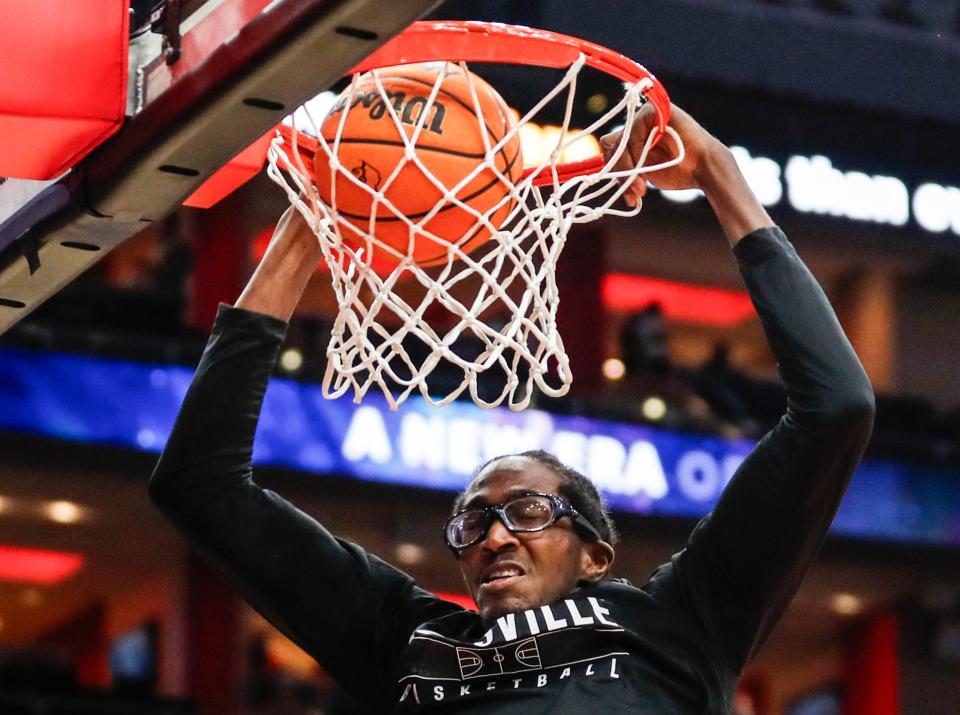 Louisville's Dennis Evans jams down two before the game against Bellarmine Wednesday night. Nov. 29, 2023