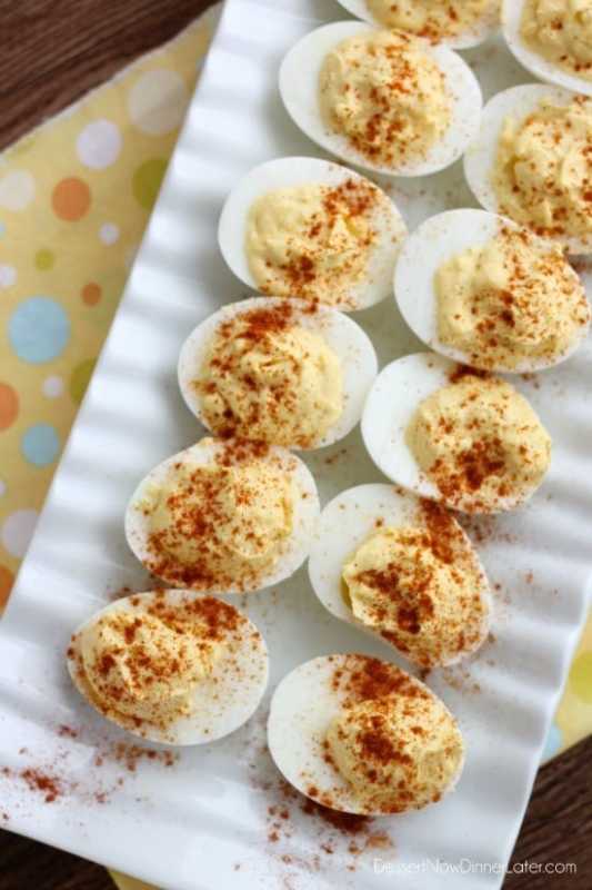 <p>Dessert Now Dinner Later</p><p>Some recipes are just classic, and these classic deviled eggs are easy and delicious! </p><p><a href="https://www.dessertnowdinnerlater.com/classic-deviled-eggs/" rel="nofollow noopener" target="_blank" data-ylk="slk:Get the Recipe;elm:context_link;itc:0;sec:content-canvas" class="link ">Get the Recipe</a></p>