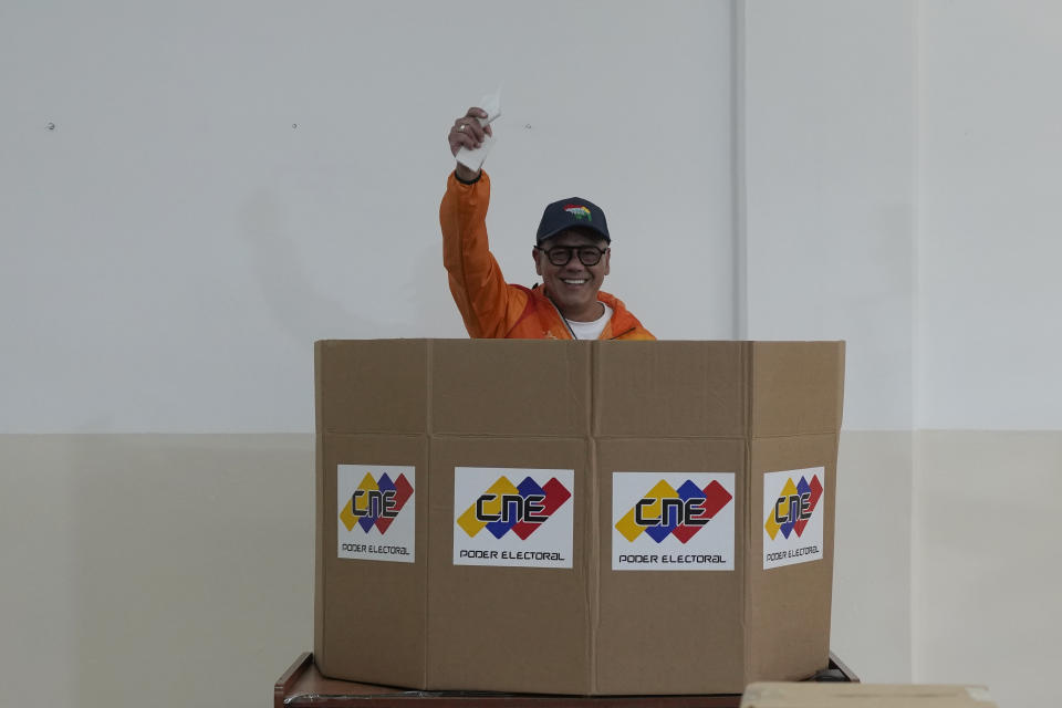 Jorge Rodriguez, President of the National Assembly shows his ballot as he participates in a voting rehearsal for the upcoming December referendum for the territorial dispute between Guayana and Venezuela in Caracas, Venezuela, Sunday, Nov. 19, 2023. (AP Photo/Ariana Cubillos)