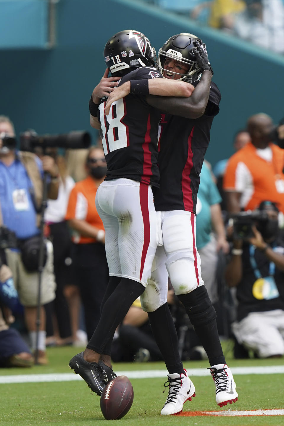 Atlanta Falcons wide receiver Calvin Ridley (18) celebrates scoring a touchdown with Atlanta Falcons quarterback Matt Ryan (2), during the first half of an NFL football game against the Miami Dolphins, Sunday, Oct. 24, 2021, in Miami Gardens, Fla. (AP Photo/Hans Deryk)