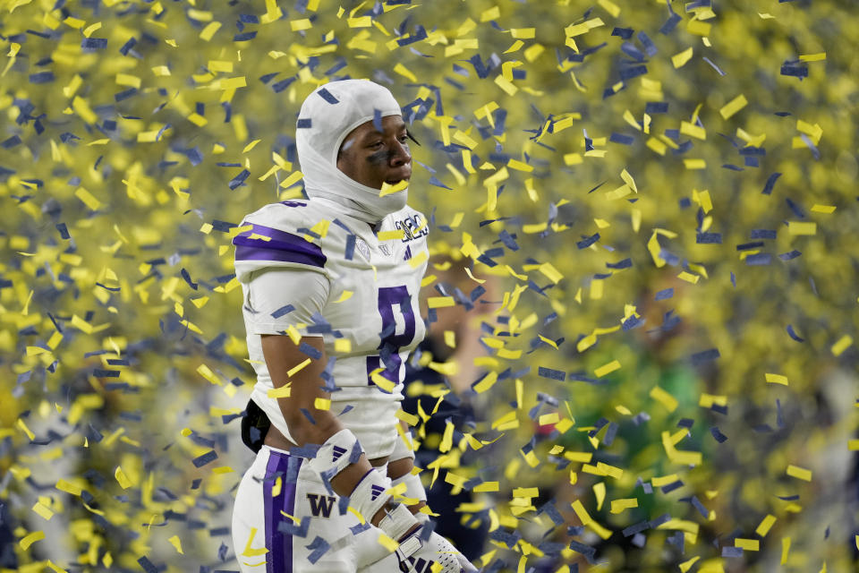 CORRECTS ID - Washington defensive back Thaddeus Dixon leaves the field after their loss to Michigan in the national championship NCAA College Football Playoff game Monday, Jan. 8, 2024, in Houston. (AP Photo/Godofredo A. Vasquez)