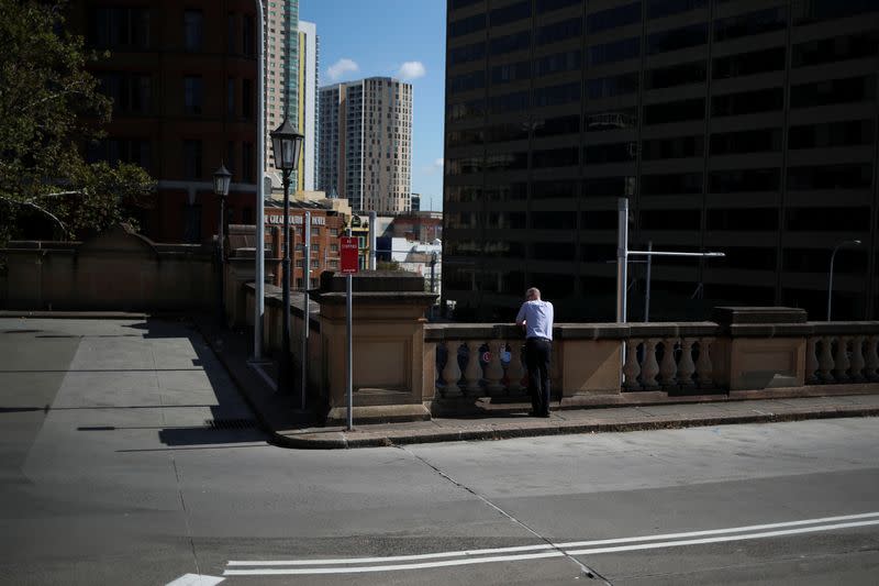 A man takes a break at Sydney Central railway station during a workday following the implementation of stricter social-distancing and self-isolation rules to limit the spread of the coronavirus disease (COVID-19) in Sydney