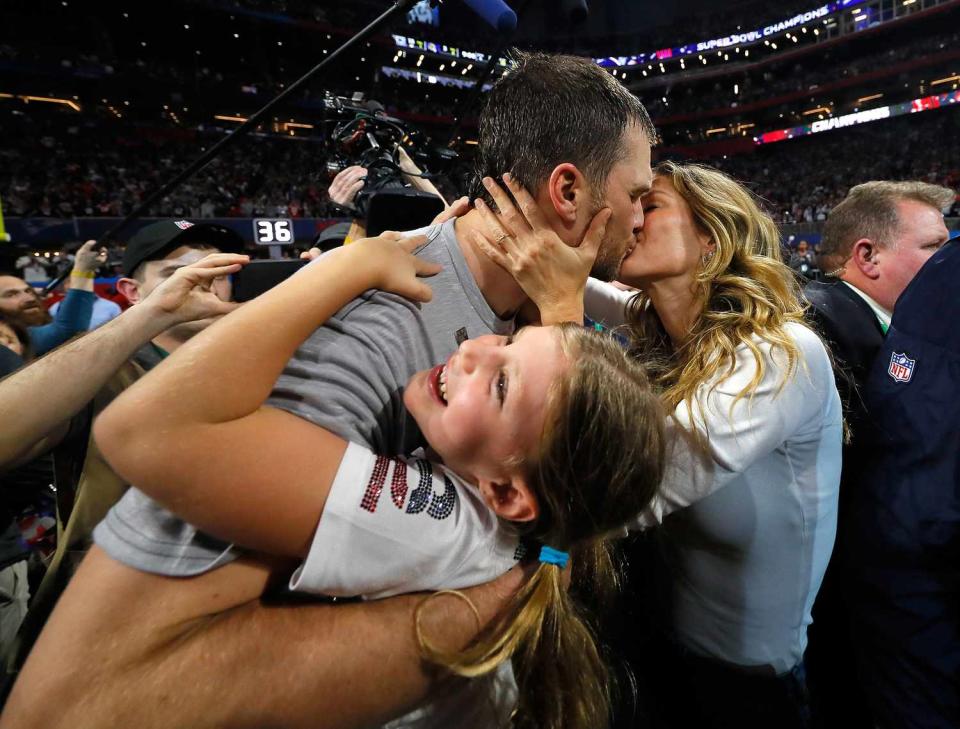 Tom Brady #12 of the New England Patriots kisses his wife Gisele Bündchen after the Super Bowl LIII against the Los Angeles Rams at Mercedes-Benz Stadium on February 3, 2019 in Atlanta, Georgia. The New England Patriots defeat the Los Angeles Rams 13-3