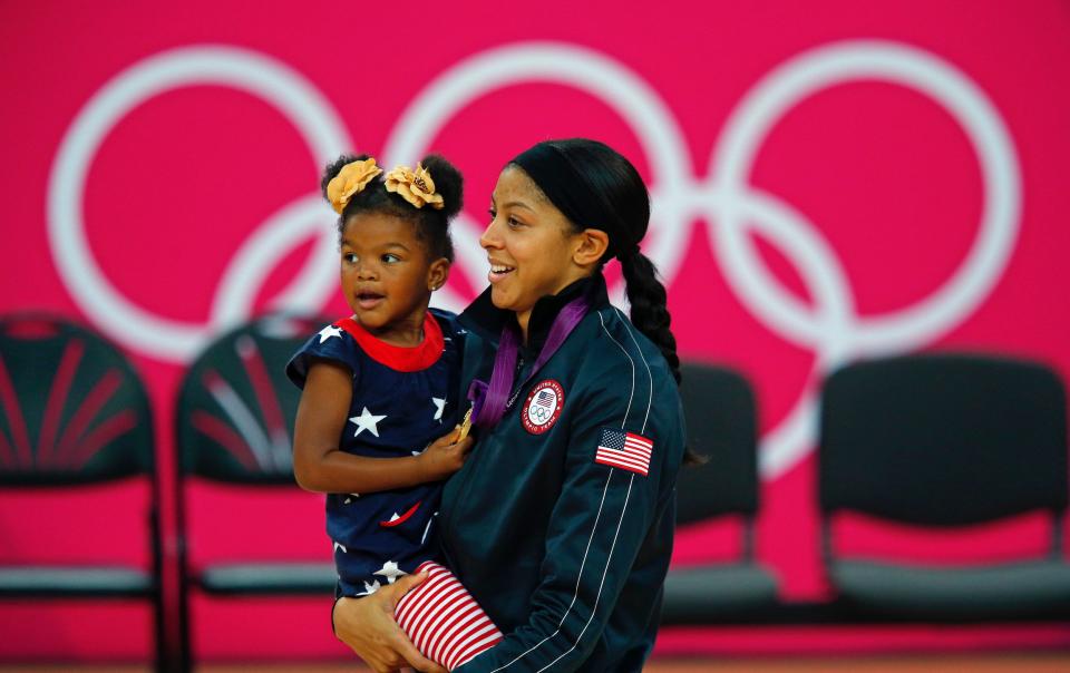 Candace Parker celebrates winning gold at the 2012 Olympics with her daughter, Laila.