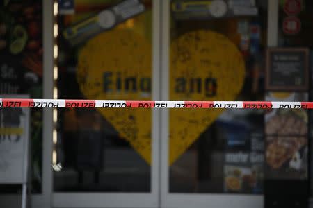 A police tape is seen after a knife attack in a supermarket in Hamburg, Germany, July 28, 2017. REUTERS/Morris Mac Matzen