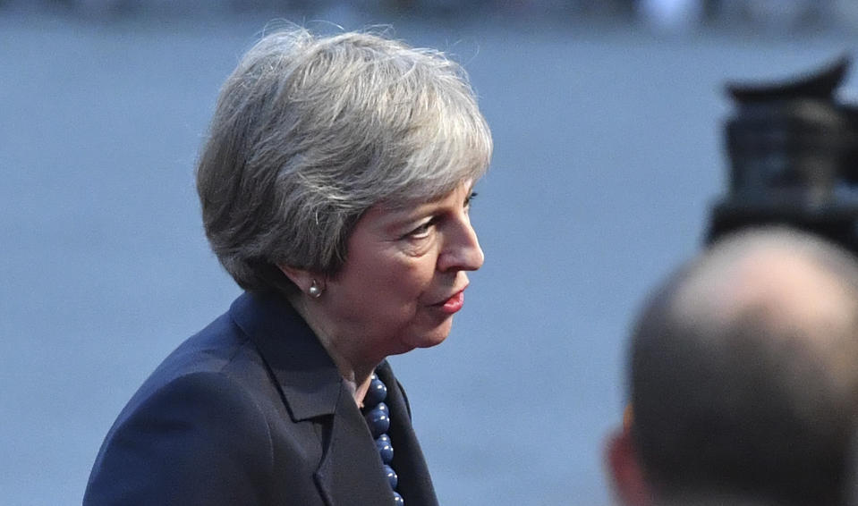 British Prime Minister Theresa May answers questions when arriving at the informal EU summit in Salzburg, Austria, Wednesday, Sept. 19, 2018. (AP Photo/Kerstin Joensson)