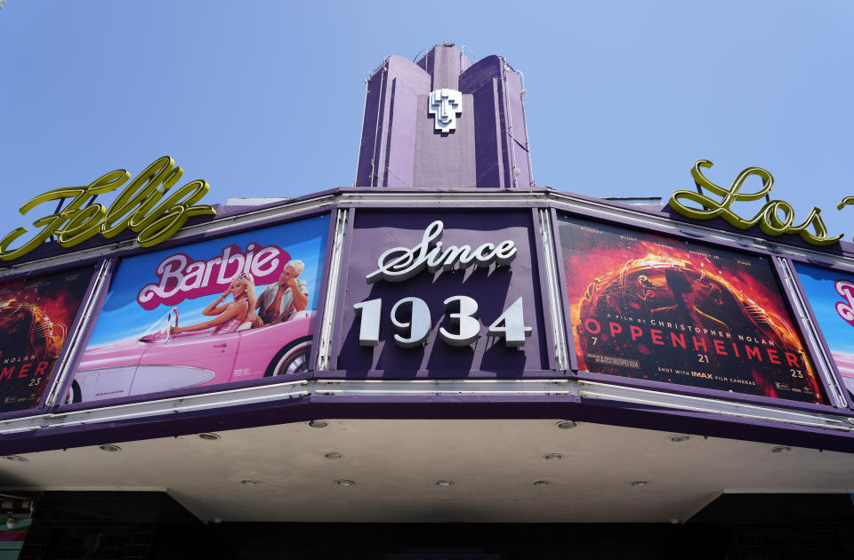 FILE - The marquee of the Los Feliz Theatre features the films "Barbie" and "Oppenheimer," on July 28, 2023, in Los Angeles. The films both premiered the same weekend. (AP Photo/Chris Pizzello, File)