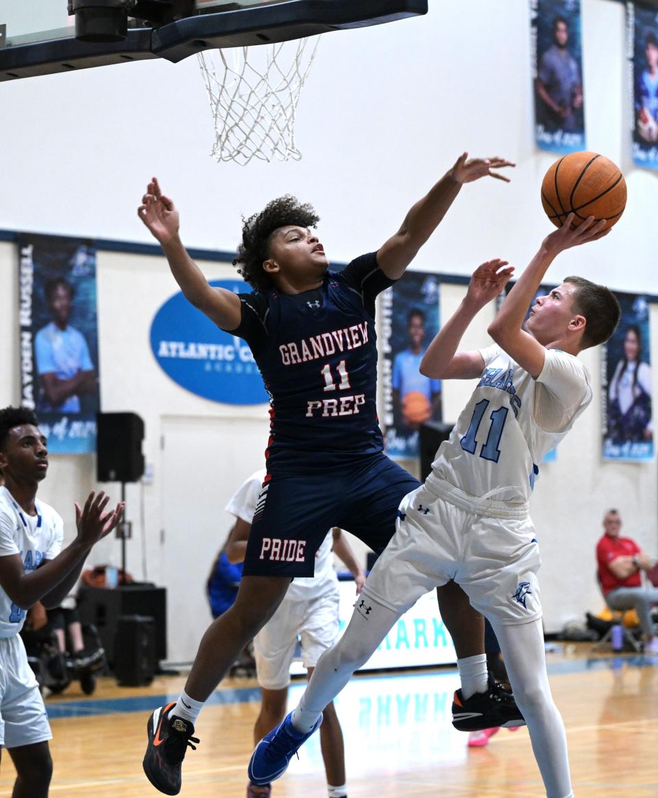 Atlantic Christian's Mikey Muscarella peels back for a hook-shot in the paint during his team's regional quarterfinals game against Grandview Prep on Feb. 15, 2024.