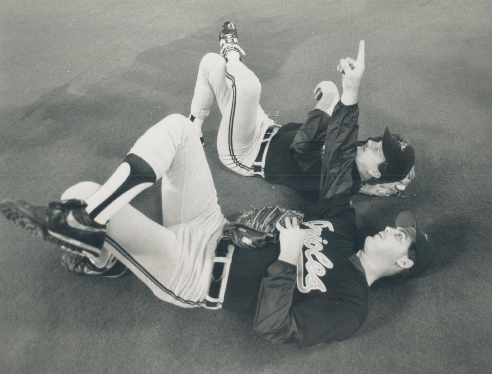 September 29, 1989: A pair of Orioles take a quick break on the SkyDome turf to check out some of the finer points of the retractable roof. (Photo by Jeff Goode/Toronto Star via Getty Images)