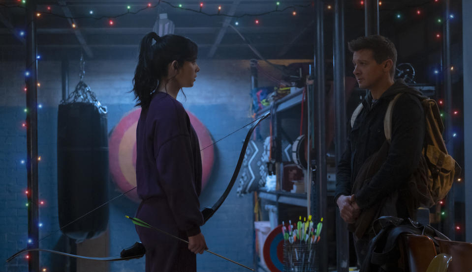 Kate Bishop and Clint Barton surrounded by Christmas Lights in the Hawkeye trailer
