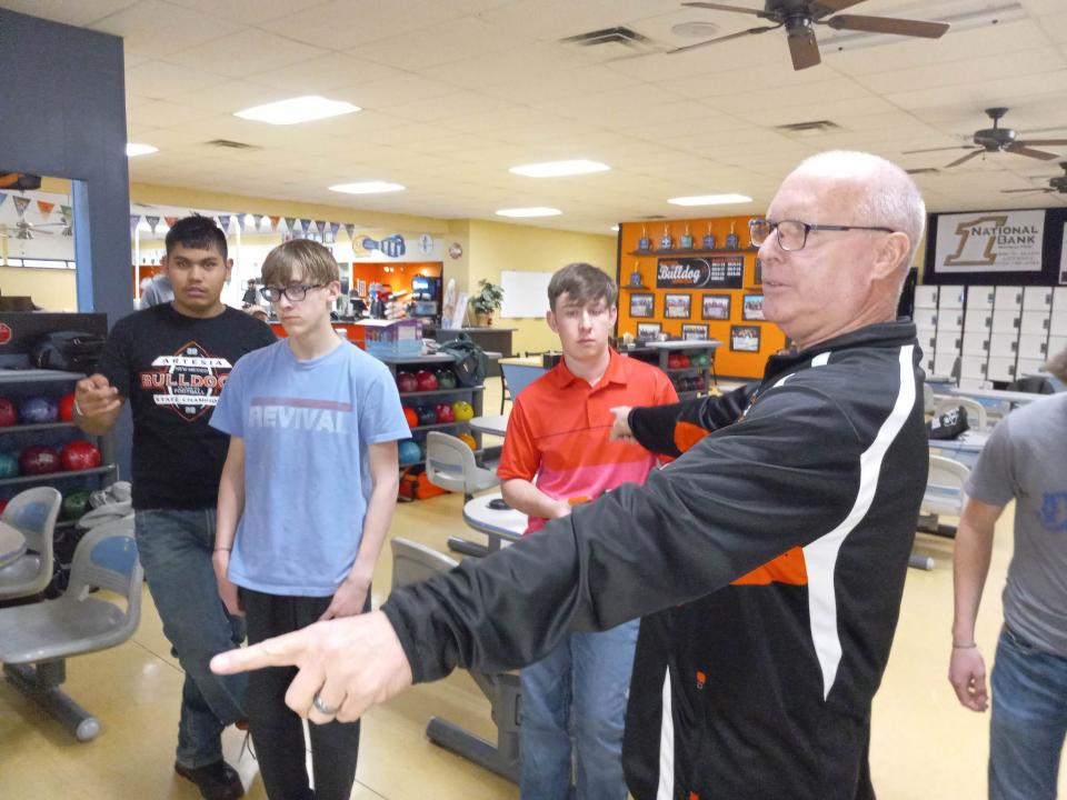 Artesia High School head bowling coach Ken Clayton shows bowlers their lanes during practice Jan. 30, 2023, at Artesia Lanes. The Bulldogs were preparing to win its eighth state championship.