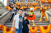 <p>Jonathan Scott and Zooey Deschanel pose for a photo with Goofy, Donald Duck and Pluto while enjoying the Halloween Time festivities at Disneyland Park in Anaheim, California, on Sept. 25. </p>