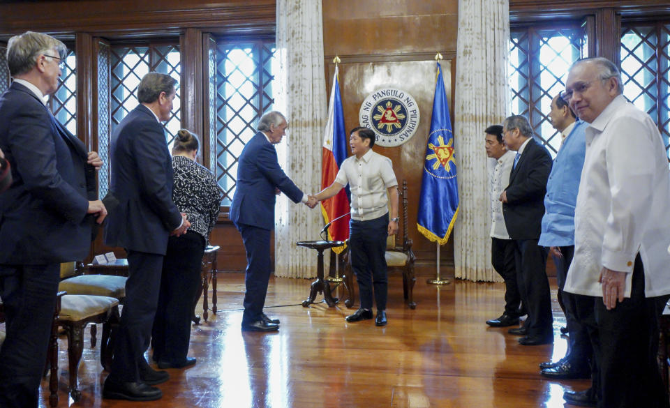 In this photo provided by the Malacanang Presidential Photographers Division, Philippine President Philippine President Ferdinand Marcos Jr., center, greets U.S. Sen. Edward Markey during the latter's courtesy call at the Malacanang presidential palace in Manila, Philippines on Thursday Aug. 18, 2022. Markey, who was once banned in the Philippines by former President Rodrigo Duterte, on Friday met a long-detained Filipino opposition leader, former senator Leila de Lima, whom he says has been wrongfully imprisoned under Duterte and should be freed. (Malacanang Presidential Photographers Division via AP)