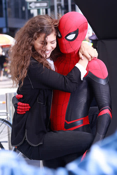 Tom Holland and Zendaya embrace on set as Spider-Man and MJ