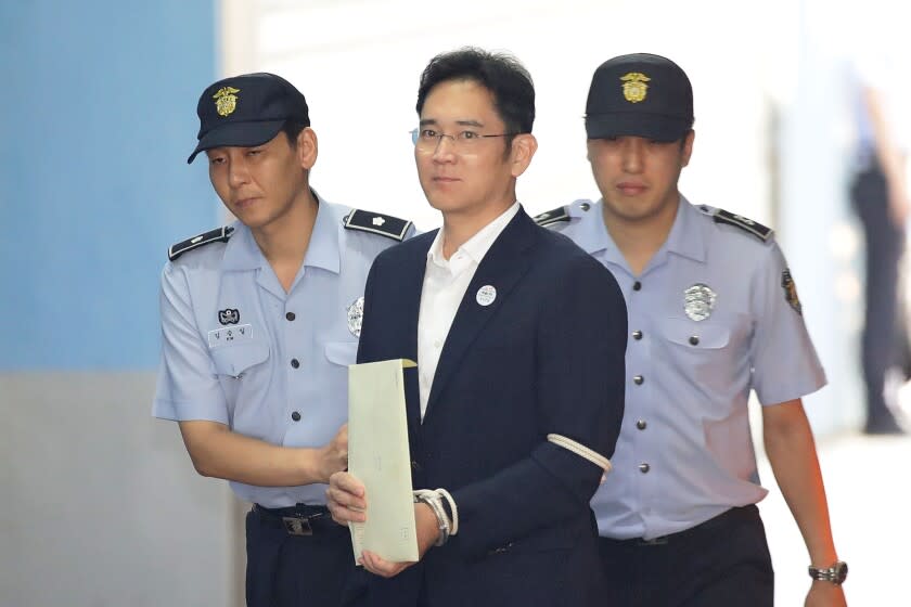 SEOUL, SOUTH KOREA - AUGUST 25: Lee Jae-yong, Samsung Group heir arrives at Seoul Central District Court to hear the bribery scandal verdict on August 25, 2017 in Seoul, South Korea. Prosecutors are seeking a 12-year jail sentence. Lee, de facto chief of South Korean conglomerate, faces five charges connecting the bribery scandal involving ousted former President Park Geun-hye and her confidant Choi Soon-sil. The verdict affects the business of Samsung, which has launched new Galaxy Note 8 smartphone to wipe out the misery of exploding Note 7 last year. (Photo by Chung Sung-Jun/Getty Images)