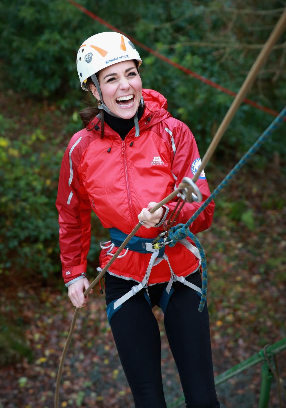 Kate Middleton laughs as she climbs at a nature center in North Wales