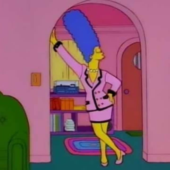 Marge posing up against the doorway